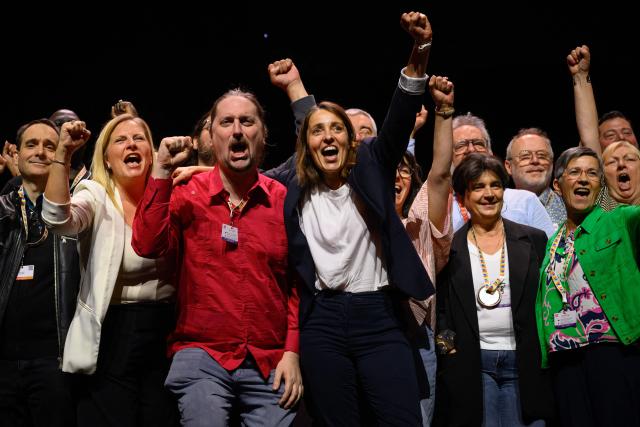 CGT leader Sophie Binet (C-R) celebrates on stage after being re-elected as General Secretary during the 54th congress of the General Confederation of Labour (CGT) French trade union in Tours, central France, on June 5, 2026. (Photo by Loic VENANCE / AFP)