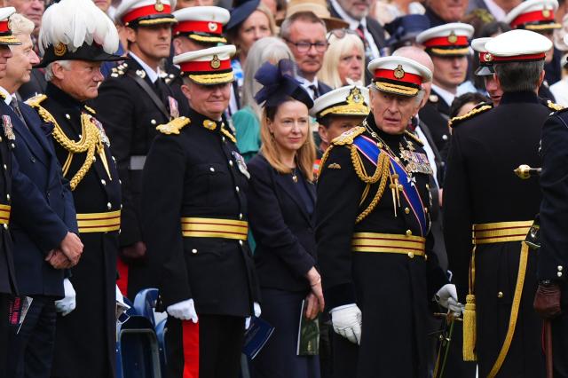 Britain's King Charles III (R) stands with members of the public and family members of the Royal Marines during a ceremony for the presentation of New Colours to the 40, 42, 43 and 45 Commando Royal Marines, at Windsor Castle, west of London on June 5, 2026. (Photo by Aaron Chown / POOL / AFP)
