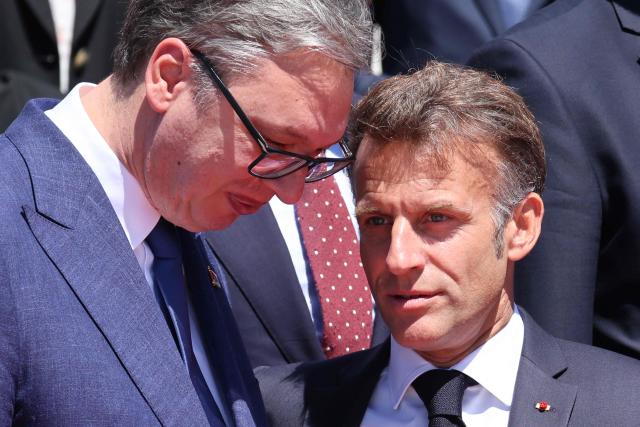 Serbian President Aleksandar Vucic (L) and French President Emmanuel Macron (R) speak after posing for a family picture as part of the EU-Western Balkans Summit at Porto Montenegro in Tivat on June 5, 2026. The summit brings together leaders from EU member states and the six Western Balkans partners to discuss enlargement and gradual integration into the EU single market. (Photo by Ludovic MARIN / AFP)