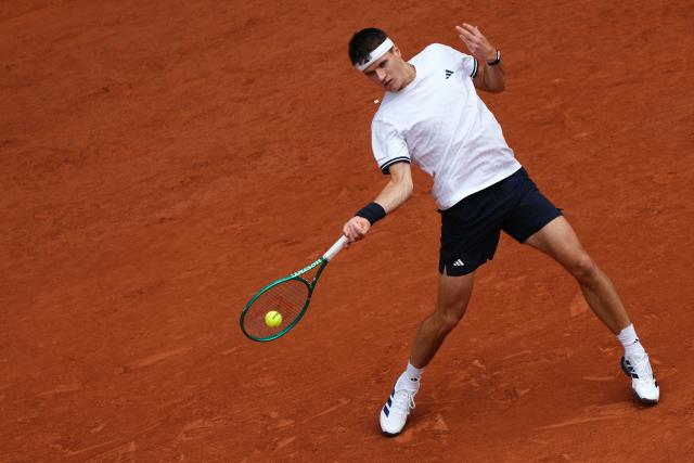Czech Republic's Jakub Mensik plays a forehand return to Germany's Alexander Zverev during their men's semi final singles match on day 13 of the French Open tennis tournament on Court Philippe-Chatrier at the Roland-Garros Complex in Paris on June 5, 2026. (Photo by Dimitar DILKOFF / AFP)