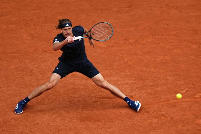 Germany's Alexander Zverev plays a forehand return to Czech Republic's Jakub Mensik during their men's semi final singles match on day 13 of the French Open tennis tournament on Court Philippe-Chatrier at the Roland-Garros Complex in Paris on June 5, 2026. (Photo by Dimitar DILKOFF / AFP)