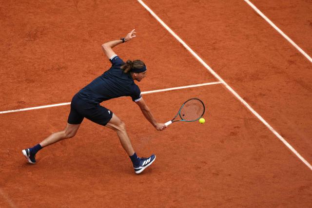 Germany's Alexander Zverev plays a backhand return to Czech Republic's Jakub Mensik during their men's semi final singles match on day 13 of the French Open tennis tournament on Court Philippe-Chatrier at the Roland-Garros Complex in Paris on June 5, 2026. (Photo by Dimitar DILKOFF / AFP)