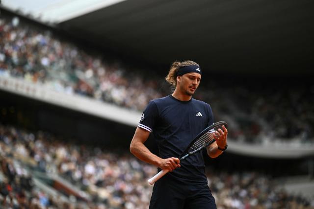 Germany's Alexander Zverev checks his racket as he plays against Czech Republic's Jakub Mensik during their men's semi final singles match on day 13 of the French Open tennis tournament on Court Philippe-Chatrier at the Roland-Garros Complex in Paris on June 5, 2026. (Photo by JULIEN DE ROSA / AFP)