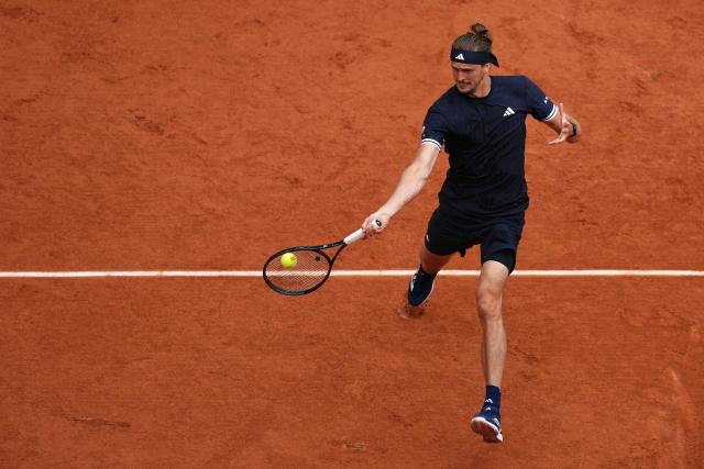 Germany's Alexander Zverev plays a forehand return to Czech Republic's Jakub Mensik during their men's semi final singles match on day 13 of the French Open tennis tournament on Court Philippe-Chatrier at the Roland-Garros Complex in Paris on June 5, 2026. (Photo by Dimitar DILKOFF / AFP)