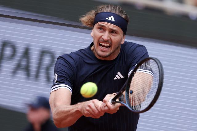 Germany's Alexander Zverev plays a backhand return to Czech Republic's Jakub Mensik during their men's semi final singles match on day 13 of the French Open tennis tournament on Court Philippe-Chatrier at the Roland-Garros Complex in Paris on June 5, 2026. (Photo by ALAIN JOCARD / AFP)