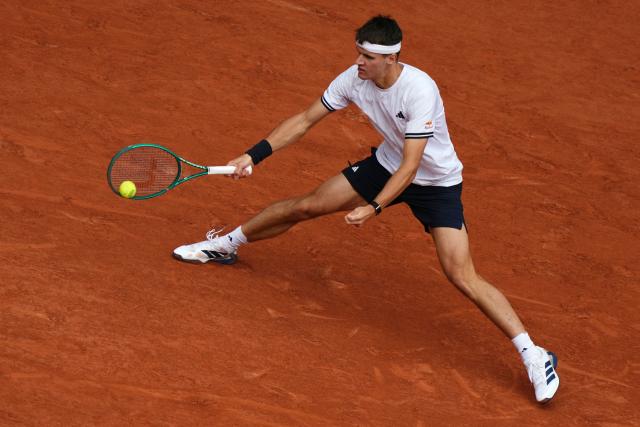 Czech Republic's Jakub Mensik plays a forehand return to Germany's Alexander Zverev during their men's semi final singles match on day 13 of the French Open tennis tournament on Court Philippe-Chatrier at the Roland-Garros Complex in Paris on June 5, 2026. (Photo by Dimitar DILKOFF / AFP)
