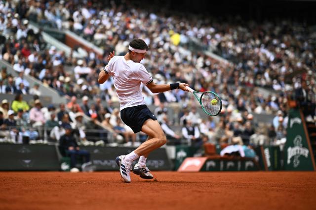 Czech Republic's Jakub Mensik plays a forehand return to Germany's Alexander Zverev during their men's semi final singles match on day 13 of the French Open tennis tournament on Court Philippe-Chatrier at the Roland-Garros Complex in Paris on June 5, 2026. (Photo by JULIEN DE ROSA / AFP)
