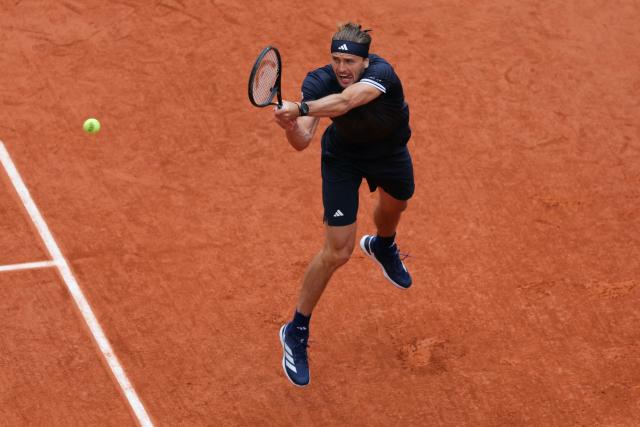 Germany's Alexander Zverev plays a backhand return to Czech Republic's Jakub Mensik during their men's semi final singles match on day 13 of the French Open tennis tournament on Court Philippe-Chatrier at the Roland-Garros Complex in Paris on June 5, 2026. (Photo by Thomas SAMSON / AFP)