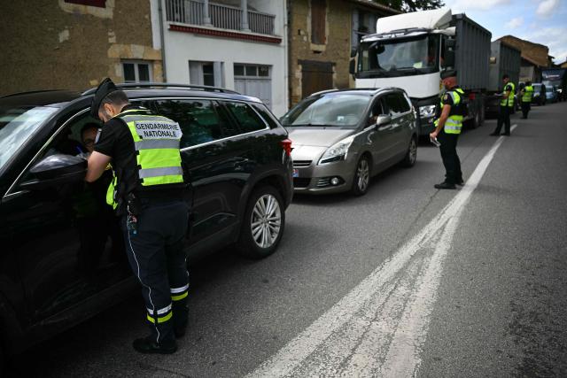 French gendarmes stop motorists as part of searches for information concerning the vehicle of suspect Jerome B after Lyhanna, an 11-year-old schoolgirl, went missing since May 29, 2026, in Fleurance, southwestern France, on June 5, 2026. France's government was on June 5 assessing possible judicial failings, after allegations investigators could have prevented a 11-year-old girl's disappearance by better dealing with previous sexual abuse complaints. Jerome B, a 41-year-old father of two, whose daughter was a school friend of Lyhanna, has been detained as the key suspect. (Photo by Lionel BONAVENTURE / AFP)