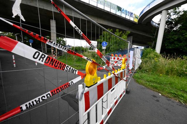The approach to the Nord-Bruecke bridge crossing the Rhine in Bonn, western Germany, is blocked on June 5, 2026, after the bridge had to be closed due to severe damage. (Photo by Roberto Pfeil / AFP)