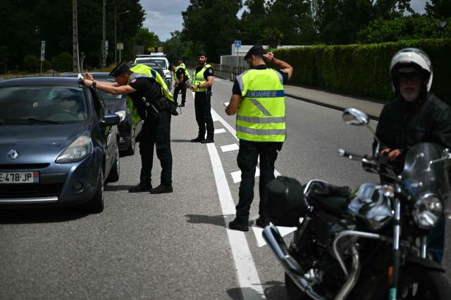 French gendarmes stop motorists as part of searches for information concerning the vehicle of suspect Jerome B after Lyhanna, an 11-year-old schoolgirl, went missing since May 29, 2026, in Fleurance, southwestern France, on June 5, 2026. France's government was on June 5 assessing possible judicial failings, after allegations investigators could have prevented a 11-year-old girl's disappearance by better dealing with previous sexual abuse complaints. Jerome B, a 41-year-old father of two, whose daughter was a school friend of Lyhanna, has been detained as the key suspect. (Photo by Lionel BONAVENTURE / AFP)