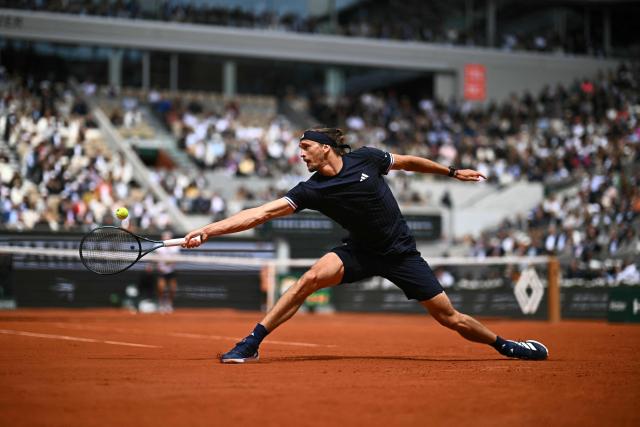 Germany's Alexander Zverev plays a backhand return to Czech Republic's Jakub Mensik during their men's semi final singles match on day 13 of the French Open tennis tournament on Court Philippe-Chatrier at the Roland-Garros Complex in Paris on June 5, 2026. (Photo by JULIEN DE ROSA / AFP)