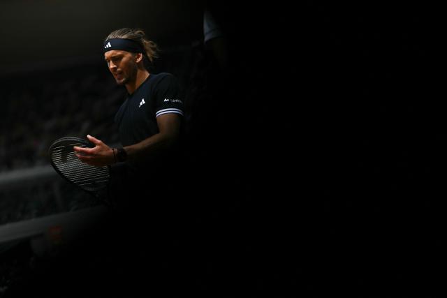 Germany's Alexander Zverev checks his racket as he plays against Czech Republic's Jakub Mensik during their men's semi final singles match on day 13 of the French Open tennis tournament on Court Philippe-Chatrier at the Roland-Garros Complex in Paris on June 5, 2026. (Photo by JULIEN DE ROSA / AFP)