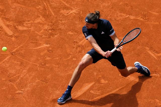 Germany's Alexander Zverev plays a backhand return to Czech Republic's Jakub Mensik during their men's semi final singles match on day 13 of the French Open tennis tournament on Court Philippe-Chatrier at the Roland-Garros Complex in Paris on June 5, 2026. (Photo by Thomas SAMSON / AFP)