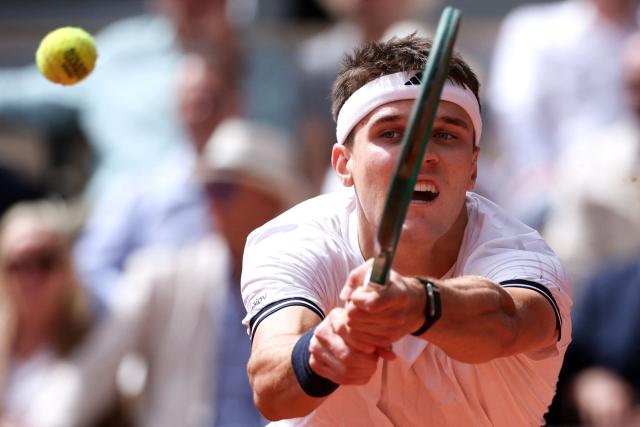 Czech Republic's Jakub Mensik plays a backhand return to Germany's Alexander Zverev during their men's semi final singles match on day 13 of the French Open tennis tournament on Court Philippe-Chatrier at the Roland-Garros Complex in Paris on June 5, 2026. (Photo by ALAIN JOCARD / AFP)