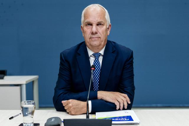 Former National Coordinator for Counterterrorism and Security (NCTV) Pieter-Jaap Aalbersberg looks on during his audition regarding his role in the course of the Corona virus (COVID-19) pandemic, on day four of the public hearings of Netherlands' Parliamentary inquiry committee into the coronavirus policy in The Hague on June 5, 2026. (Photo by Remko de Waal / ANP / AFP) / Netherlands OUT