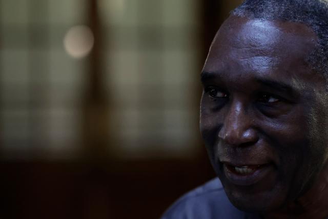 (FILES) Rwandan doctor Eugene Rwamucyo accused of participation in the 1994 Tutsi genocide, arrives at the Paris Assize Court on October 1, 2024. The appeal trial of former Rwandan doctor Eugene Rwamucyo charged with complicity in genocide in Rwanda, will start in Paris on June 9 until June 10, 2026. (Photo by STEPHANE DE SAKUTIN / AFP)