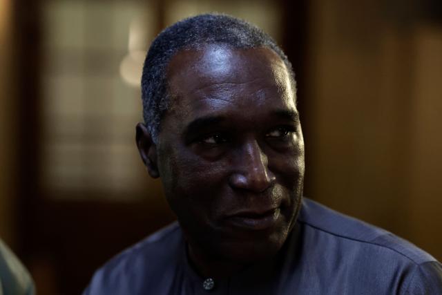 (FILES) Rwandan doctor Eugene Rwamucyo accused of participation in the 1994 Tutsi genocide, arrives at the Paris Assize Court on October 1, 2024. The appeal trial of former Rwandan doctor Eugene Rwamucyo charged with complicity in genocide in Rwanda, will start in Paris on June 9 until June 10, 2026. (Photo by STEPHANE DE SAKUTIN / AFP)