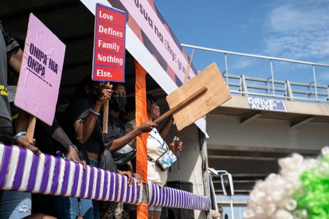Protesters march behind a bus during a march for peace and family diversity organised by a coalition of feminist and human rights organisations in Accra on June 5, 2026. The march came a week after Ghana's parliament passed a controversial anti-LGBTQ bill that would further restrict LGBTQ rights and criminalise the promotion of LGBTQ activities. Demonstrators also protested against the fourth Pan-African Conference on Family Values, currently held for the first time in Accra. (Photo by Claudia LACAVE / AFP)