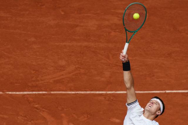 Czech Republic's Jakub Mensik serves to Germany's Alexander Zverev during their men's semi final singles match on day 13 of the French Open tennis tournament on Court Philippe-Chatrier at the Roland-Garros Complex in Paris on June 5, 2026. (Photo by Dimitar DILKOFF / AFP)