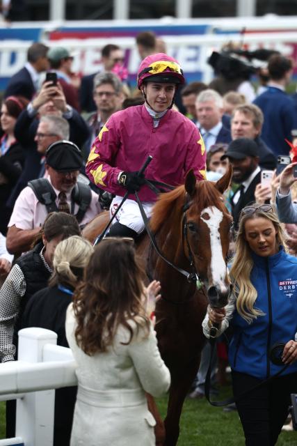 Jockey Dylan Browne McMonagle returns to the winner's enclosure after winning The Oaks on Thundering On to victory on the opening day of the Epsom Derby Festival horse racing event in Surrey, southern England on June 5, 2026. (Photo by Henry NICHOLLS / AFP)