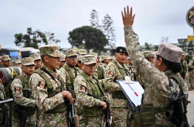 Army soldiers prepare to board buses to be deployed to polling stations to provide security and safeguard electoral materials in Lima on June 5, 2026, ahead of the presidential election runoff. Right-wing candidate Keiko Fujimori and leftist Roberto Sanchez will face off in Peru's presidential runoff on June 7, 2026. (Photo by MARTIN BERNETTI / AFP)