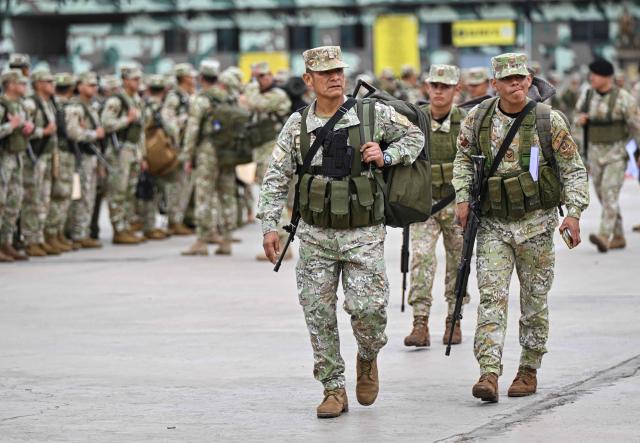 Army soldiers prepare to board buses to be deployed to polling stations to provide security and safeguard electoral materials in Lima on June 5, 2026, ahead of the presidential election runoff. Right-wing candidate Keiko Fujimori and leftist Roberto Sanchez will face off in Peru's presidential runoff on June 7, 2026. (Photo by MARTIN BERNETTI / AFP)