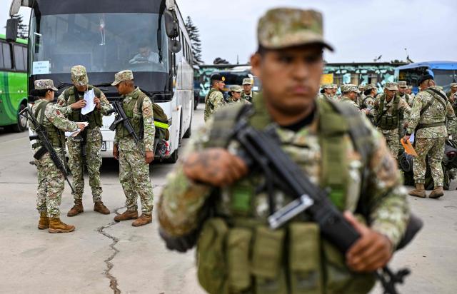 Army soldiers prepare to board buses to be deployed to polling stations to provide security and safeguard electoral materials in Lima on June 5, 2026, ahead of the presidential election runoff. Right-wing candidate Keiko Fujimori and leftist Roberto Sanchez will face off in Peru's presidential runoff on June 7, 2026. (Photo by MARTIN BERNETTI / AFP)