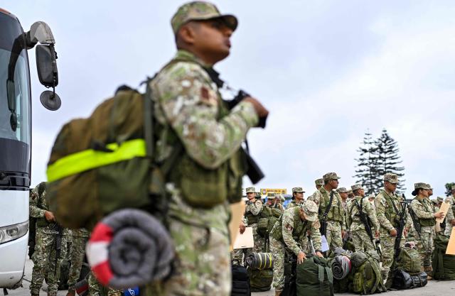 Army soldiers prepare to board buses to be deployed to polling stations to provide security and safeguard electoral materials in Lima on June 5, 2026, ahead of the presidential election runoff. Right-wing candidate Keiko Fujimori and leftist Roberto Sanchez will face off in Peru's presidential runoff on June 7, 2026. (Photo by MARTIN BERNETTI / AFP)