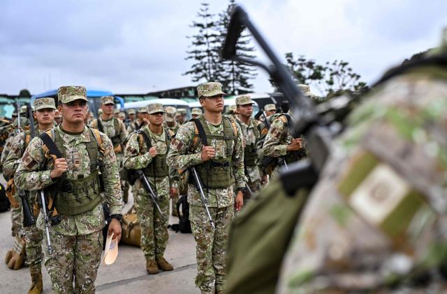 Army soldiers prepare to board buses to be deployed to polling stations to provide security and safeguard electoral materials in Lima on June 5, 2026, ahead of the presidential election runoff. Right-wing candidate Keiko Fujimori and leftist Roberto Sanchez will face off in Peru's presidential runoff on June 7, 2026. (Photo by MARTIN BERNETTI / AFP)