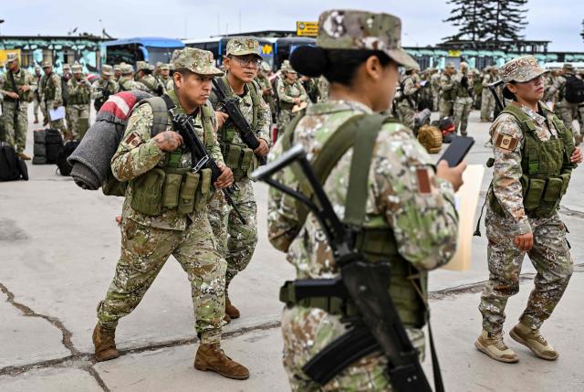 Army soldiers prepare to board buses to be deployed to polling stations to provide security and safeguard electoral materials in Lima on June 5, 2026, ahead of the presidential election runoff. Right-wing candidate Keiko Fujimori and leftist Roberto Sanchez will face off in Peru's presidential runoff on June 7, 2026. (Photo by MARTIN BERNETTI / AFP)
