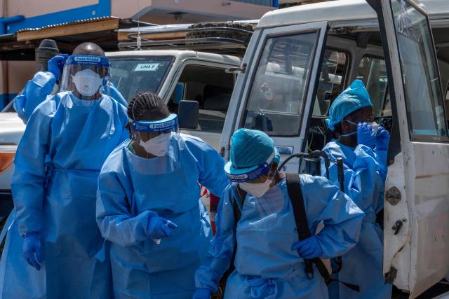 Teams responsible for dignified and safe burials are preparing to retrieve the body of a person suspected of having died from Ebola in Bunia, in the eastern Democratic Republic of the Congo, on June 5, 2026. (Photo by GLODY MURHABAZI / AFP)