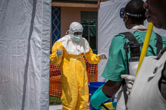 A member of the Doctors Without Border (MSF) personnel at the Elikya clinic Ebola treatment center prepares to remove his personal protection equipment (PPE) in Bunia, in the eastern Democratic Republic of the Congo, on June 5, 2026. (Photo by GLODY MURHABAZI / AFP)