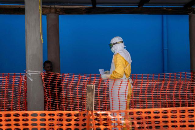 A healthcare worker with the organization Doctors Without Borders (MSF) stands in the contaminated zone at the Elikya clinic Ebola treatment center in Bunia, in the eastern Democratic Republic of the Congo, on June 5, 2026. (Photo by GLODY MURHABAZI / AFP)