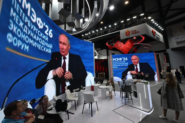 Screens show Russian President Vladimir Putin participating in the plenary session of the St. Petersburg International Economic Forum (SPIEF) in Saint Petersburg on June 5, 2026. (Photo by OLGA MALTSEVA / AFP)