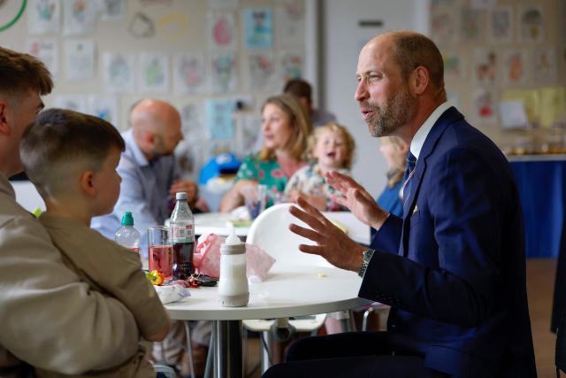 Britain's Prince William, Prince of Wales, meets with serving submariners and their families at Drumfork Centre on the Churchill Estate on June 2, 2026 in Helensburgh, Scotland. Prince Wlliam, Prince of Wales, of Wales, Commodore-in-Chief of the Submarine Service, visited HM Naval Base Clyde (also known as Faslane) to mark the 125th anniversary of the Royal Navy's Submarine Service. (Photo by Jeff J Mitchell / POOL / AFP)