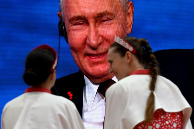 A screen shows Russian President Vladimir Putin participating in the plenary session of the St. Petersburg International Economic Forum (SPIEF) in Saint Petersburg on June 5, 2026. (Photo by OLGA MALTSEVA / AFP)