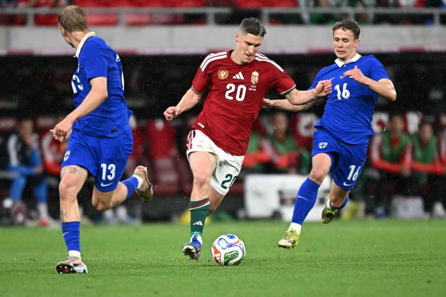 Hungary's forward #20 Roland Sallai (C), Finland's defender #13 Rony Jansson (L) and Finland's midfielder #16 Anssi Suhonen (R) vie for the ball during the friendly football match between Hungary and Finland at the Puskas Arena in Budapest on June 5, 2026. (Photo by Attila KISBENEDEK / AFP)
