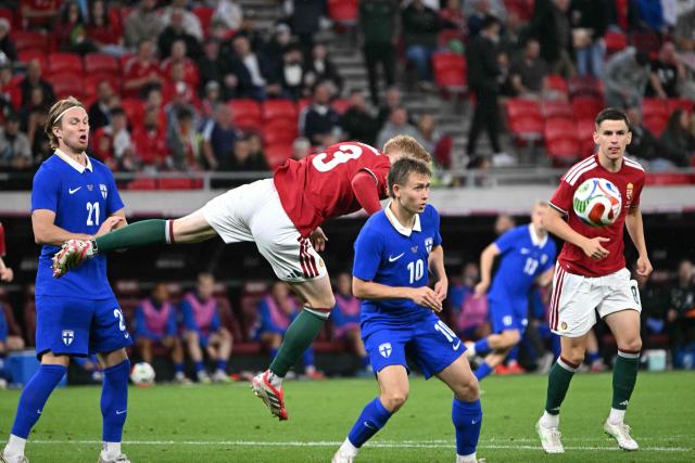Hungary's defender #03 Mark Csinger (C,L) and Finland's midfielder #10 Naatan Skytta vie for the ball during the friendly football match between Hungary and Finland at the Puskas Arana in Budapest on June 5, 2026. (Photo by Attila KISBENEDEK / AFP)
