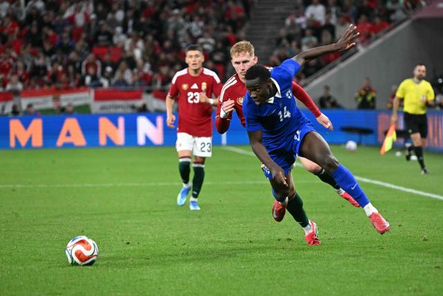 Finland's defender #14 Ryan Mahuta and Hungary's defender Mark Csinger vie for the ball during the friendly football match between Hungary and Finland at the Puskas Arana in Budapest on June 5, 2026. (Photo by Attila KISBENEDEK / AFP)