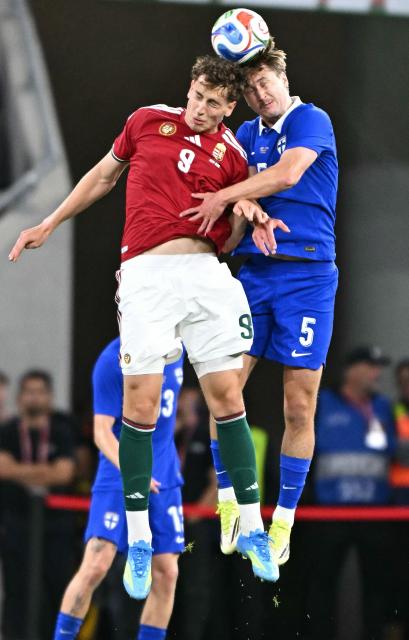 Finland's midfielder #05 Miro Tenho and Hungary's forward #09 Szabolcs Schon both jump to head the ball during the friendly football match between Hungary and Finland at the Puskas Arana in Budapest on June 5, 2026. (Photo by Attila KISBENEDEK / AFP)