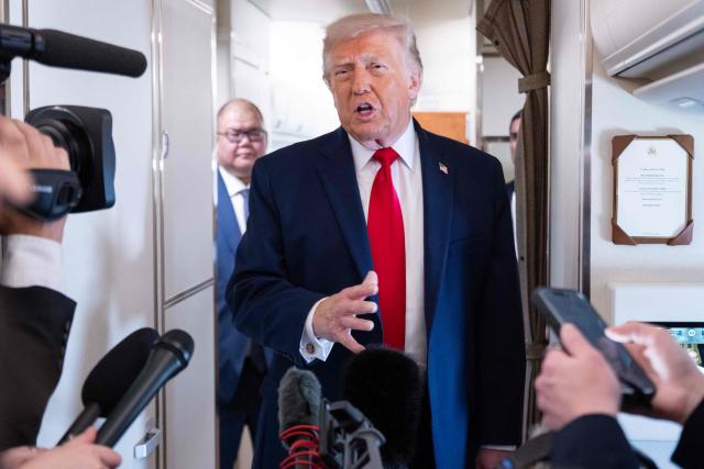 US President Donald Trump speaks with the press aboard Air Force One as he flies from Joint Base Andrews in Maryland to Eau Claire, Wisconsin, June 5, 2026. Trump will participate in a rural economic roundtable on American agriculture in Chippewa Falls. (Photo by SAUL LOEB / AFP)