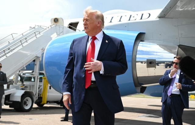 US President Donald Trump looks on after stepping off Air Force One at Chippewa Valley Regional Airport in Eau Claire, Wisconsin, on June 5, 2026. Trump will participate in a rural economic roundtable on American agriculture in Chippewa Falls. (Photo by SAUL LOEB / AFP)