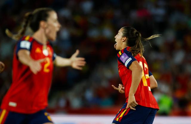 Spain's midfielder #12 Patri Guijarro (R) celebrates scoring the opening goal during the FIFA Women's World Cup Europe Zone Qualifiers, group C, football match between Spain and England at Mallorca Son Moix Stadium in Palma de Mallorca, on June 5, 2026. (Photo by JAIME REINA / AFP)