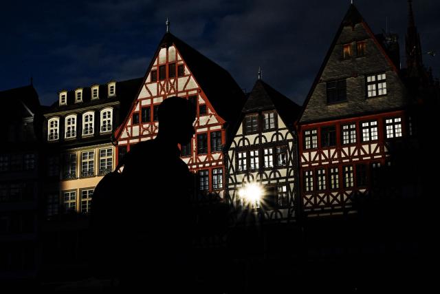 A man walks along on the central Roemer Square in Frankfurt am Main, western Germany, on June 5, 2026 with air temperature reaching 19 degrees Celsius. (Photo by Kirill KUDRYAVTSEV / AFP)