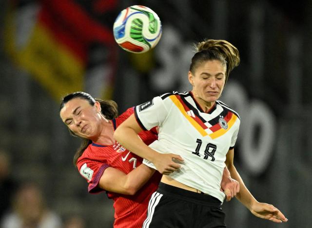 Germany's forward #18 Melissa Koessler (R) and Norway's midfielder #07 Ingrid Syrstad Engen vie for the ball during the Women's FIFA World Cup qualifying football match between Germany and Norway in Cologne, western Germany on June 5, 2026. (Photo by INA FASSBENDER / AFP) / ALTERNATIVE CROP