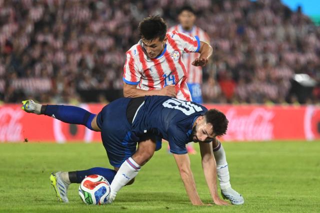 Nicaragua's midfielder #10 Jacob Montes and Paraguay's midfielder #14 Andres Cubas fight for the ball during the international friendly football match between Paraguay and Nicaragua at the Defensores del Chaco Stadium in Asuncion on June 5, 2026. (Photo by DANIEL DUARTE / AFP)