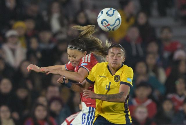 Chile's midfielder #10 Yanara Aedo and Ecuador's defender #04 Justine Cuadra jump for the ball during the CONMEBOL Nations League Women football match between Chile and Ecuador at the National Stadium in Santiago on June 5, 2026. (Photo by Rodrigo ARANGUA / AFP)