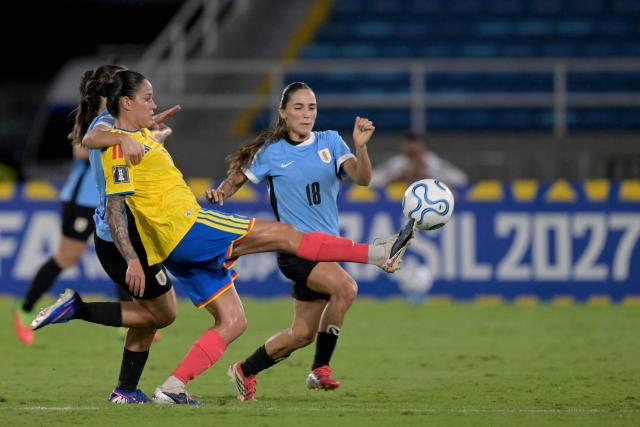 Colombia's midfielder #08 Marcela Restrepo fights for the ball with Uruguay's forward #11 Esperanza Pizarro and Uruguay's midfielder #18 Solange Lemos during the CONMEBOL Nations League Women football match between Colombia and Uruguay at the Pascual Guerrero stadium in Cali, Valle del Cauca department, Colombia on June 5, 2026. (Photo by JOAQUIN SARMIENTO / AFP)