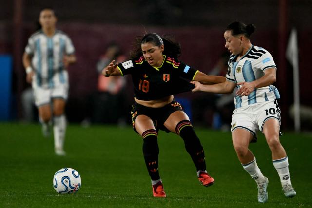 Peru's midfielder #19 Andrea Thorisson and Argentina's midfielder #10 Maricel Pereyra fight for the ball during the CONMEBOL Nations League Women football match between Argentina and Peru at the Florencio Sola stadium in Buenos Aires on June 5, 2026. (Photo by Luis ROBAYO / AFP)